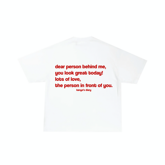 White crew neck t-shirt with text printed on the back in red,可分为'the person behind me, you look great today! lots of love, the person in front of you. kanye's diary'.